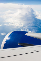 Passenger Jet Airplane Engine and Clouds