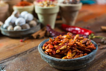 Red hot chili pepper dried on wooden background