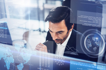 Concept of digital diagram,graph interfaces,virtual screen,connections icon.Young entrepreneur working at modern office.Blurred background.Horizontal.