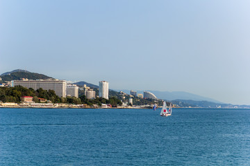 view of the coast of Sochi,Russia. the Black sea coast with sailing boats.