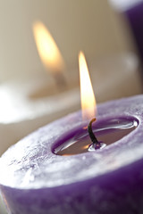 close up burning purple candle