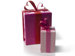 Set of pink gift boxes on white background.