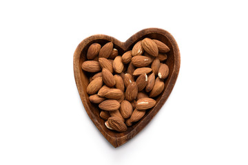 Top view dried almond in wood bowl on white background.