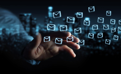 Businessman holding and touching floating emails sketch