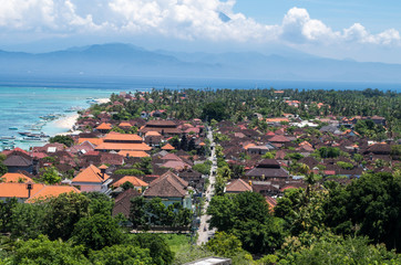 Obraz premium Street at Jungut Batu Beach with Bali in the background, Nusa Lembongan, Indonesia.