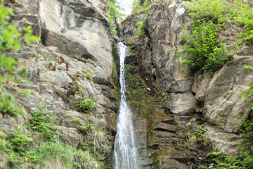 Fototapeta na wymiar Waterfall of the Finsterbach at the Ossiacher lake