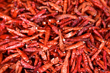Dried chili peppers background. Many red hot pigments chile wallpaper, the combined or pile. Thai food seasoning. Close up and macro....