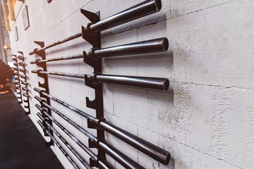 Barbell weight bars on the stand
