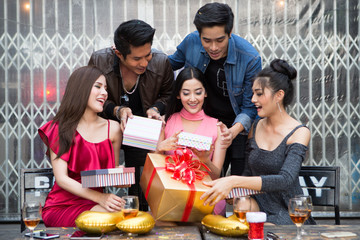 Happy friends greeting in New year party and celebrating birthday gift concept