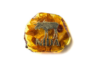 Nida (Lithuania) souvenir refrigerator magnet isolated on white. Refrigerator magnets are popular souvenir and collectible objects. 