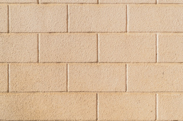 Big beige brick wall as a background, texture