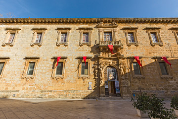 Fototapeta na wymiar Facade of a historic building in the center of Mazara del Vallo in Sicily, Italy.