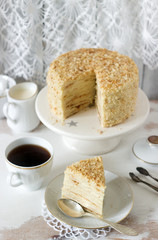 Napoleon cake made of puff pastry and custard vanilla cream on a white background. Rustic style.