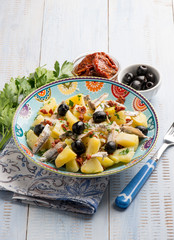 salad with potatoes anchovies dried tomatoes and black olives