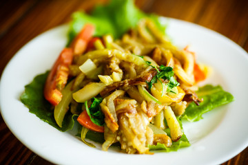 Warm summer salad of fried vegetables with tomatoes