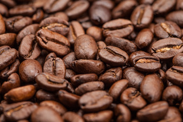 Macro Roasted brown coffee beans as background