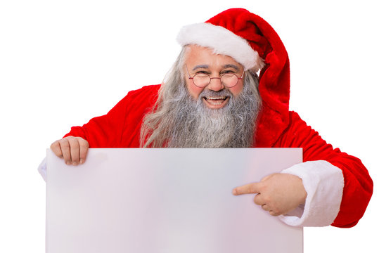 Lachender Weihnachtsmann zeigt auf Schild in der Hand