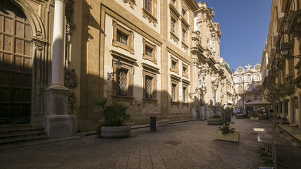 People walking in the central street of Trapani, on a summer afternoon.