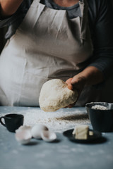 Woman working with dough 