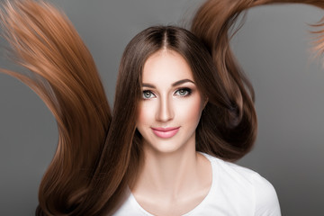  woman with shiny straight long hair. 