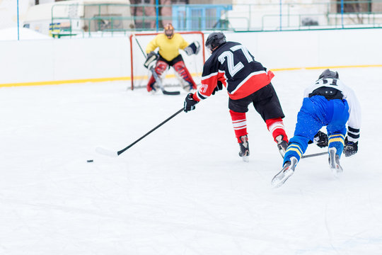 Young skater man in attack. Ice hockey game image with copy space