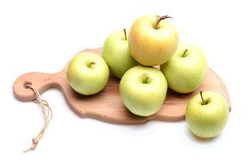 Apples on board isolated on white background.