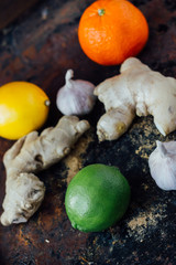 Citrus fruits with garlic and ginger root