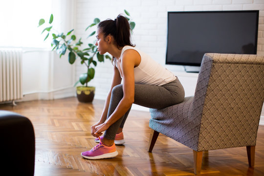 Young woman preparing for exercise at home