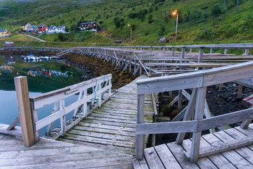 Berth and Wooden rack for drying code on the island Soroya, Norway