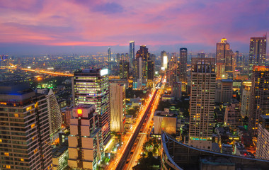 Fototapeta na wymiar Aerial View of City Building beside Sathorn Street, Famous Business Center of Thailand