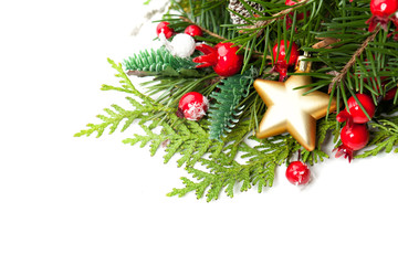 Christmas Decor, Evergreen Xmas Tree, Gold Star and Red Berries on White Background. New Year Christmas Background with Copy Space