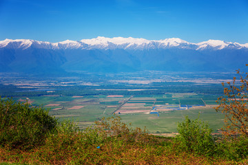 View of Signagi and Alazani Valley with snow on Caucasus mountain chain