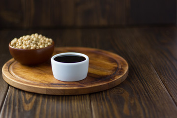 Beautiful soy sauce in a white ceramic bowl