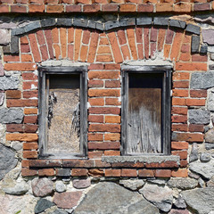 Window of a derelict barn in Masuria in Poland