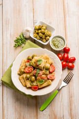 paccheri with pesto fresh tomatoes and parmesan cheese