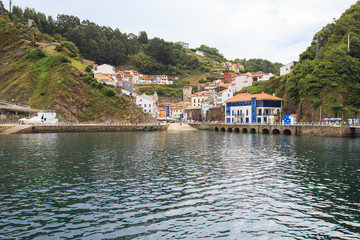 Fototapeta na wymiar View from water to Cudillero, small fishing village in Asturias, Spain. 