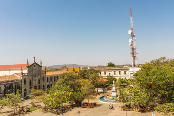 Fototapeta na wymiar Leon, Nicaragua, March, 24, 2017: Central park view from Cathedral. The most touristic place in Leon, Nicaragua, central America
