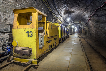 Yellow passenger underground train in a mine