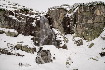 Waterfall in mountains at winter © Jaroslav Moravcik