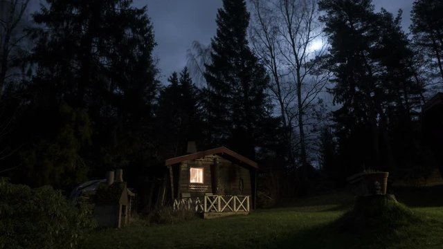 Time-lapse of Small sauna, during moonlight.