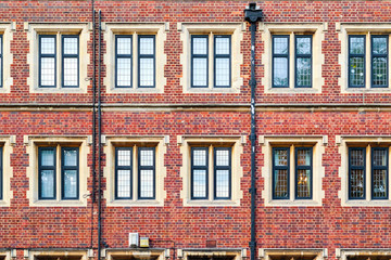 Facade of brick mansion block in London