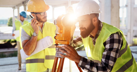 Team of architects people in group on construciton site