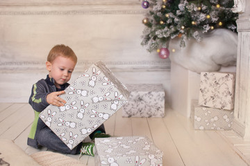 Naklejka premium Boy, Christmas atmosphere at home, Christmas tree