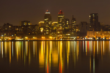 Fototapeta premium View to the right bank of Dnipro city at night, lights reflected on the river Dnieper, Ukraine, (Dnipro, Dnipropetrovsk, Dnepropetrovsk)