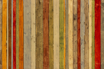 Old wooden fence. Close-up shot of multicolored wooden wall. Wooden texture. Wooden Fence.
