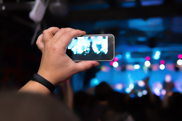 Video recording of the concert on the smartphone phone of the Beach or club party. Ð¡onceptual background of the youth party.