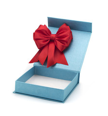 Open blue box for a gift with a red bow on a white background