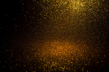 Fototapeta na wymiar gold glitter Christmas lights abstract background. de-focused.