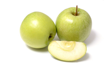 Group of ripe green apples with green apple leaf and green apple slice isolated on white background.