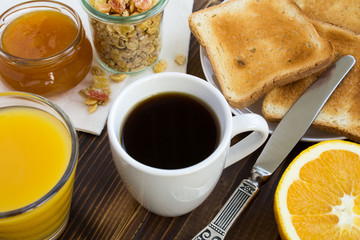 Breakfast on the brown wooden background